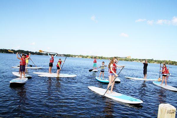 Middle School students paddleboard on Lake Brantley during P.E.