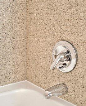 A refinished bathtub with multistone tile is beautiful