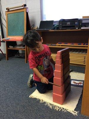 Pink tower and brown stairs. Montessori works.