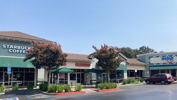 Exterior view with handicap parking in front, and Starbucks and IHOP, on either side.