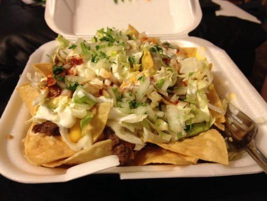 Beef nachos, there is plenty of cheese sauce and beef under there too