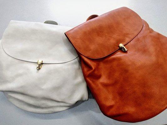 An adorable backpack made of vegan leather. Handbags, wallets, and backpacks available in store at Bobbi's at Parkside.