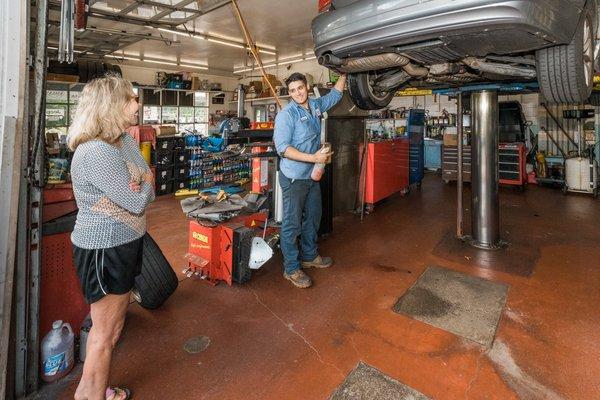 Lucas inspecting and repairing a customer's tire.