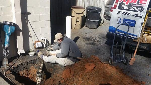 One of our certified technicians working on a busted sewer line