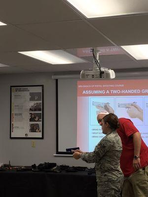 Working on proper hand position on a dummy pistol at our Ladies Only class.