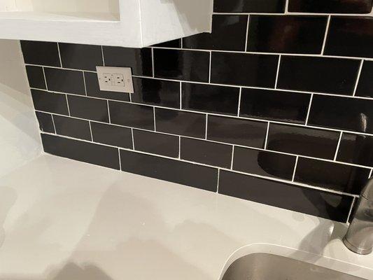 They helped me match and cut the longer tiles to fill in the gap's under the old black tiles above after I replaced the counter.