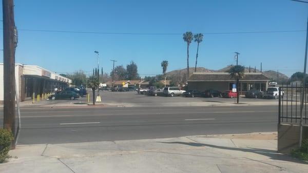 The liquor store and burger joint across the street