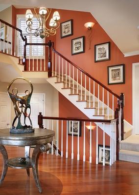 Townhouse reno. Foyer, change in wall color, railing & access to front door created a dramatic focal as well as better flow.