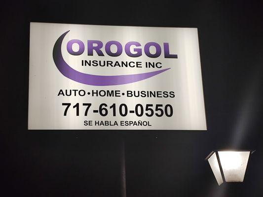 Night view of OROGOL Insurance Inc Corner Street sign - Corner of Jonestown Road & Earl Ave