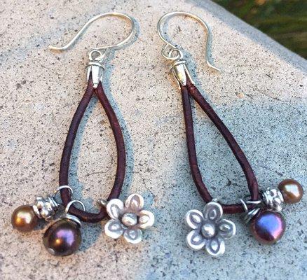 Earrings of freshwater pearls, sterling silver flowers and leather