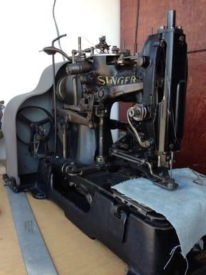 Old-school sewing machine on display.