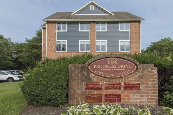 Signage for PennDIOS, The Oral Surgery Group, on front of building signage.