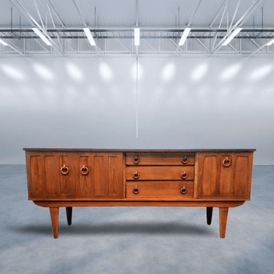 Beautility UK vintage teak cocktail credenza with wooden ring pulls.