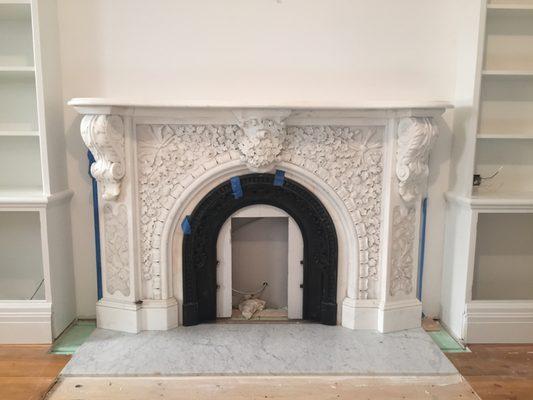 Restored and installed an antique marble mantle