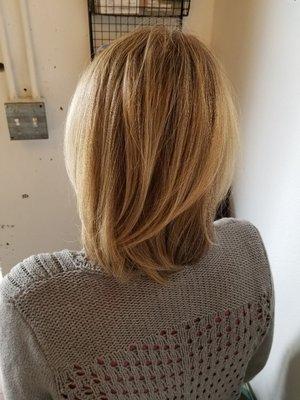 Work by Mitch at Modify Hair Lounge: A short and sassy haircut and partial foil highlight.