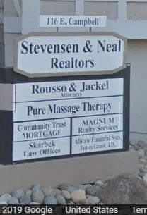 Outside of Building. Look for the "Stevensen & Neal Realtors" Sign. Enter into the driveway & down ramp for parking.