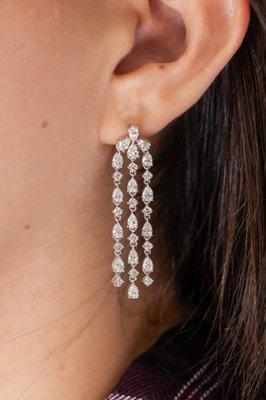 Dangling pear cut earrings