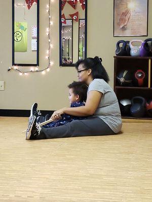 Mom and child participating in POUND for kids at FFXP Headquarters!