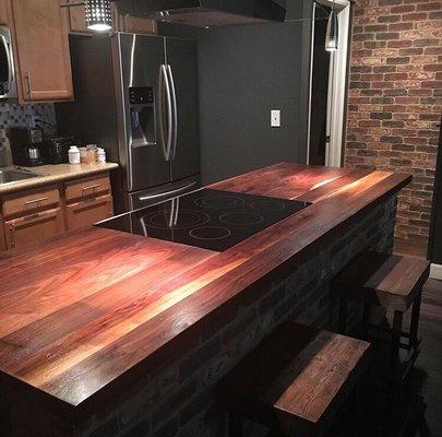 2" thick wide plank walnut counter top and custom island with built in stove