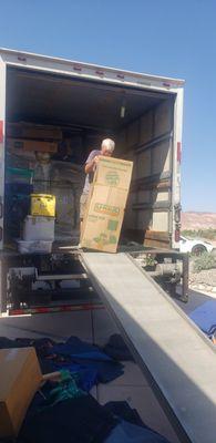 My husband unloading the truck Princz "collaborated with" for our delivery.