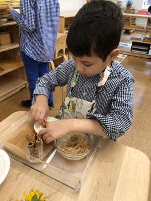 One area of the Montessori classroom is "Practical Life," where students learn independence.