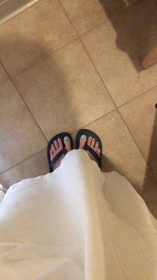 The robe and flip flops that the spa provided for the massage