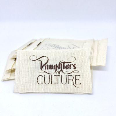 Daughters of Culture: This is a PRINT LABEL on natural cotton material finished with an end fold.