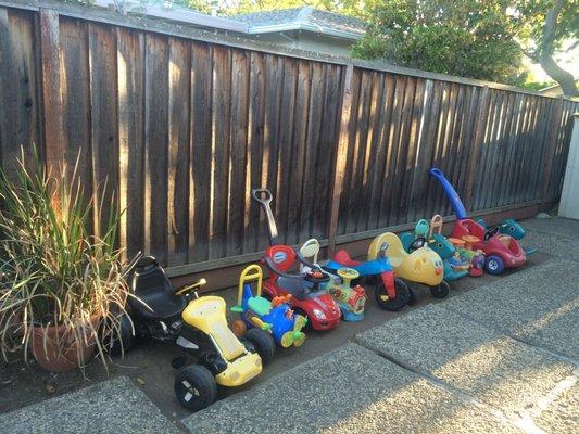 Ride-ons help to develop motor skills in young children. We have lots of them for the children to play with during outside time!