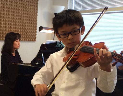 Student playing violin