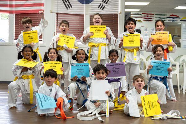 Cheers and achievements at T.O. Westlake Karate! Our karate kids proudly display new belts and certificates. Join our winning team today!