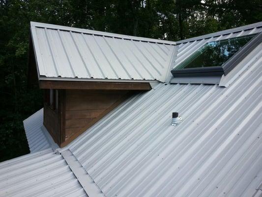 Here a metal roof was installed for durability as well as style.  A skylight was added to provide natural light to an interio...