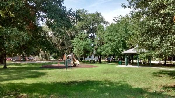 Oval shaped Robert G. Gardner Park is next to the building