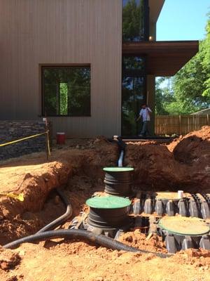 Underground cistern suitable for irrigating the entire garden. Saves 50,000 gallons/year.