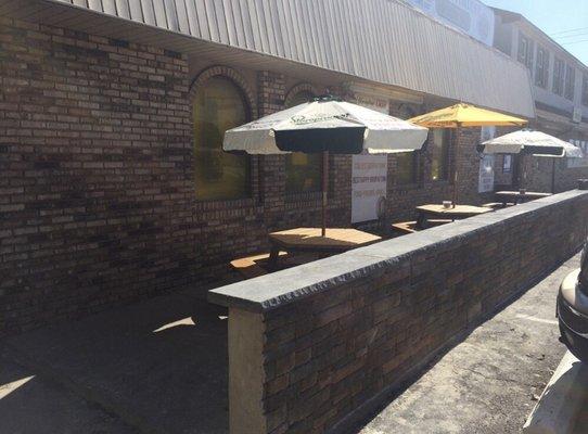 Patio with outdoor seating and standing room.