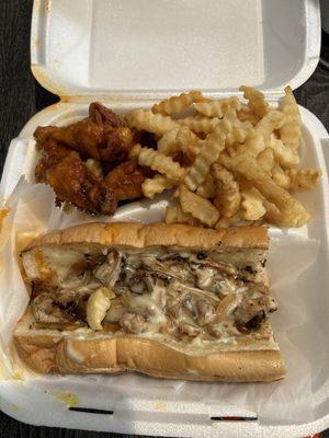 Philly sandwich, wings and fries.