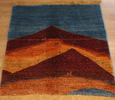 Another gabbeh rug with mountains.