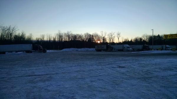 Large parking lot as the sun rises.