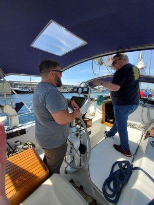 Ellis at the helm helping us understand the intricacies of our new boat.