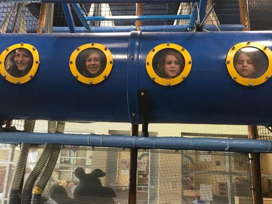 kids playing in one of the tubes