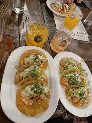 Left: Fish (salmon) taco  Drink- mango guava margarita  Right: Chicken tinga taco Drink- strawberry margarita