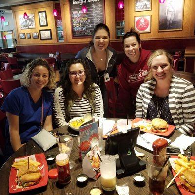 Office staff celebrating at Red Robin.