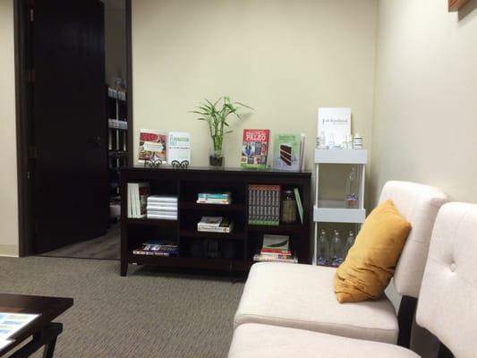 Part of the lobby with homeopathic books, paleo cookbooks, natural face and akin care products.