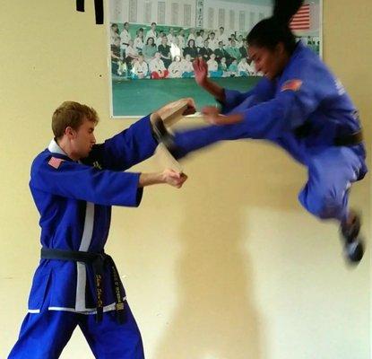 Flying kick by instructor