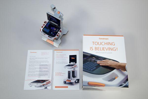 Carestream Touch Prime Ultrasound: The dimensional mailer captivated the target audience with a miniature paper model of their machine.