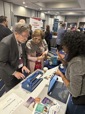 Octane Med Tech attendees learning braille.