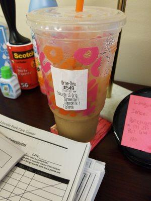 Large, Carmel ice coffee made with Almond milk and three splenda.