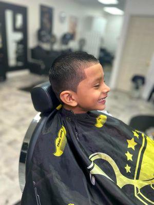 Our little customer is absolutely thrilled with his fresh new haircut!