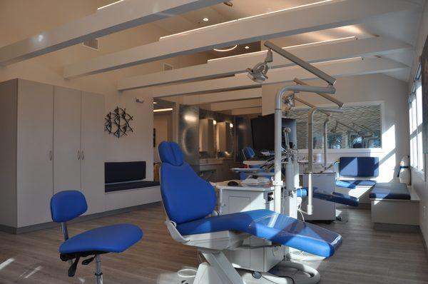 Orthodontic treatment bay with three semi-private rooms as well