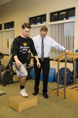 Dr. Green shows Austin Goerke the importance of proper form.