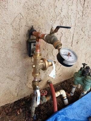 Install pressure regulator to reduce pressure to home